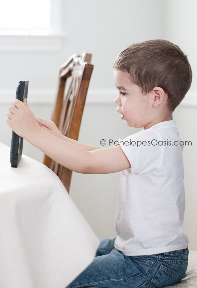 boys plays with ipad all day