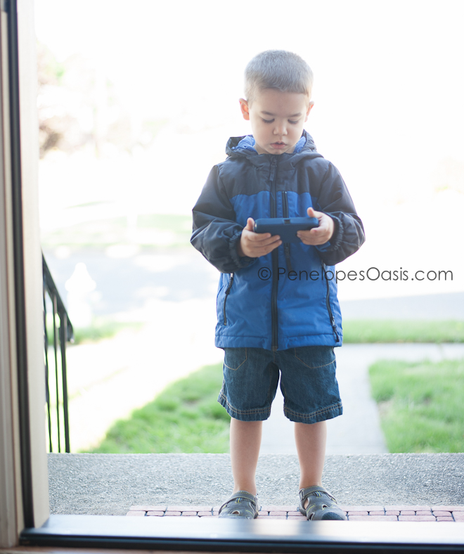 boys plays with iphone