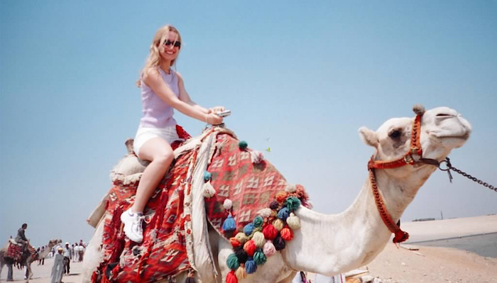 penelope guzman on a camel in egypt
